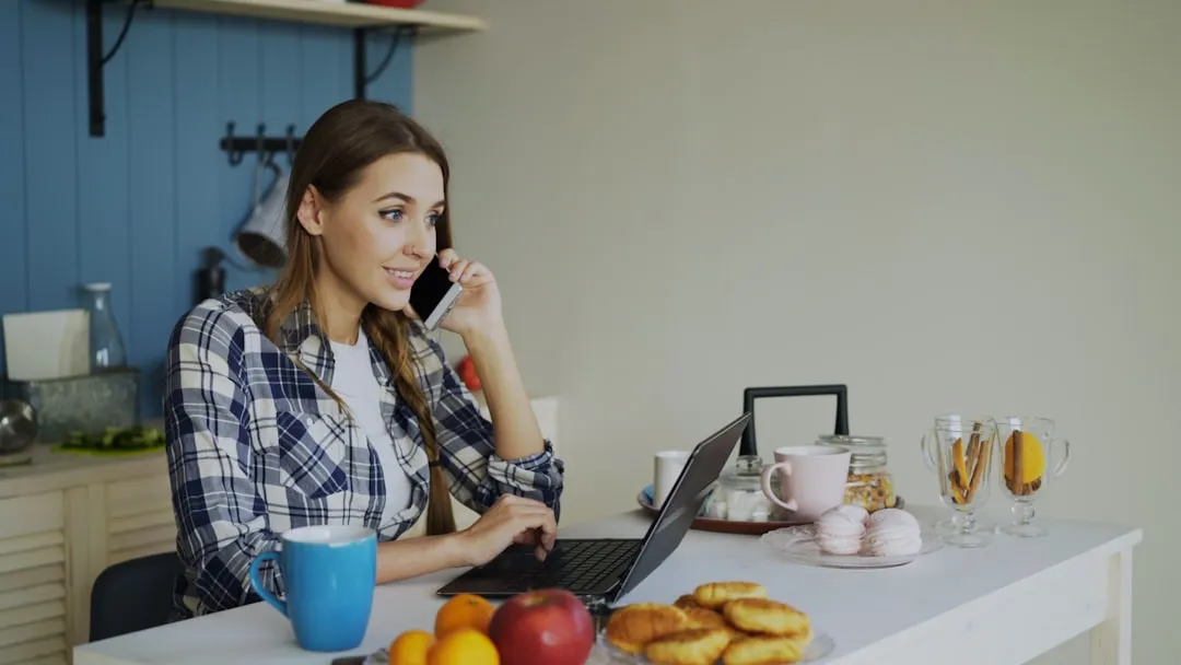 Woman applying by phone and laptop